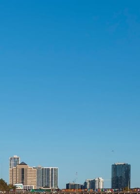 Balcony with black chairs overlooking the Austin city skyline
