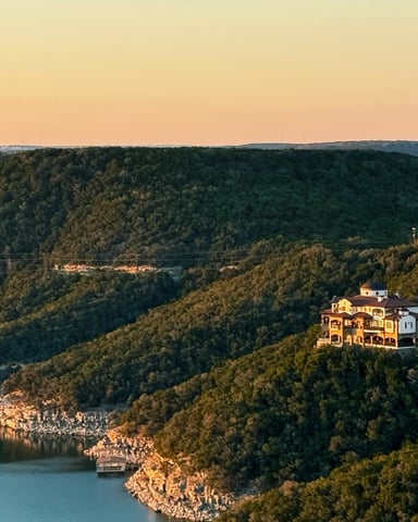 Lake Travis Hill Country homes on the bluff at golden hour