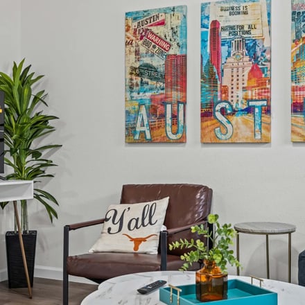 Bright living room with mid-century chairs and sliding glass door